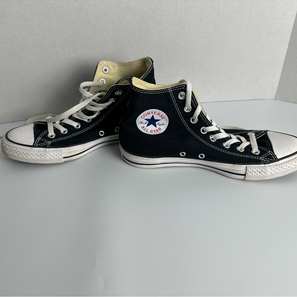Converse Black and White High-Tops woman’s size 9 men’s size 7.